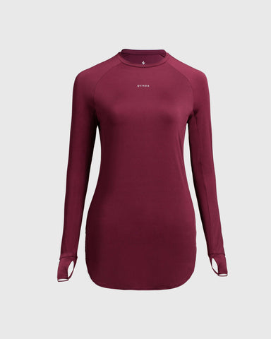 A, modest maroon MOD LONG SLEEVE T-SHIRT by Qynda with a fitted design, prominently displaying a small Qynda logo on the chest.