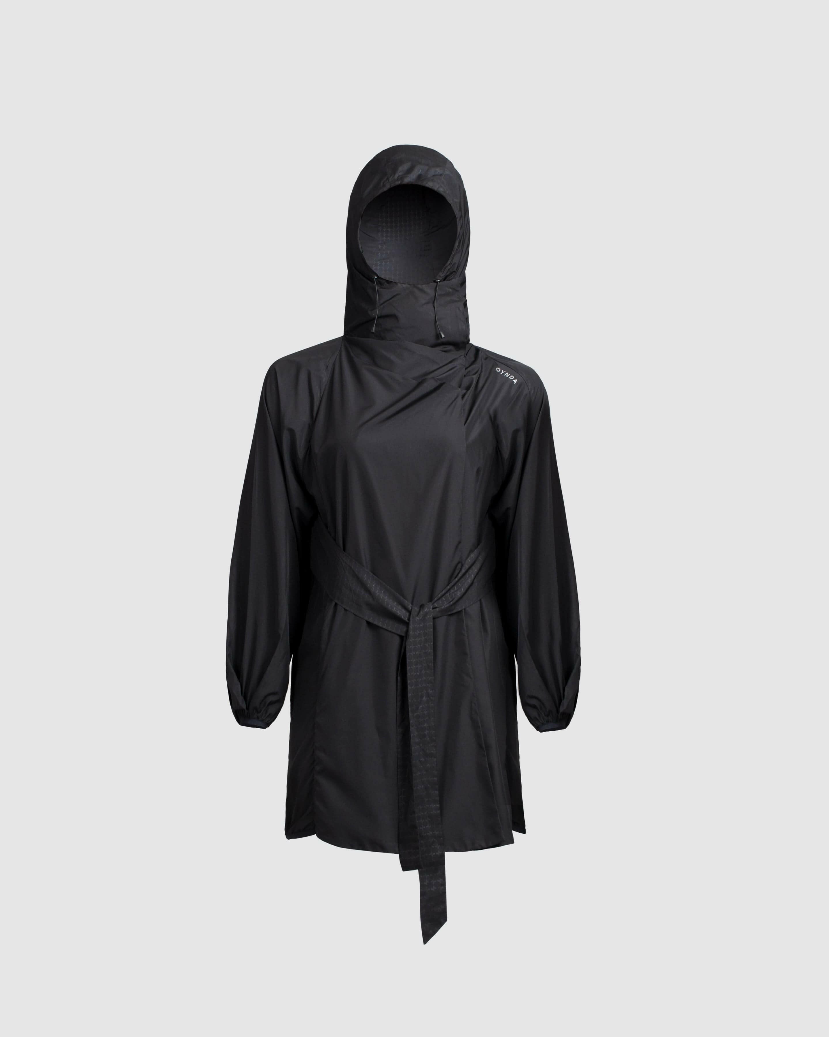 A lightweight black COOLDOWN coat by Qynda with a hood, displayed against a neutral background.