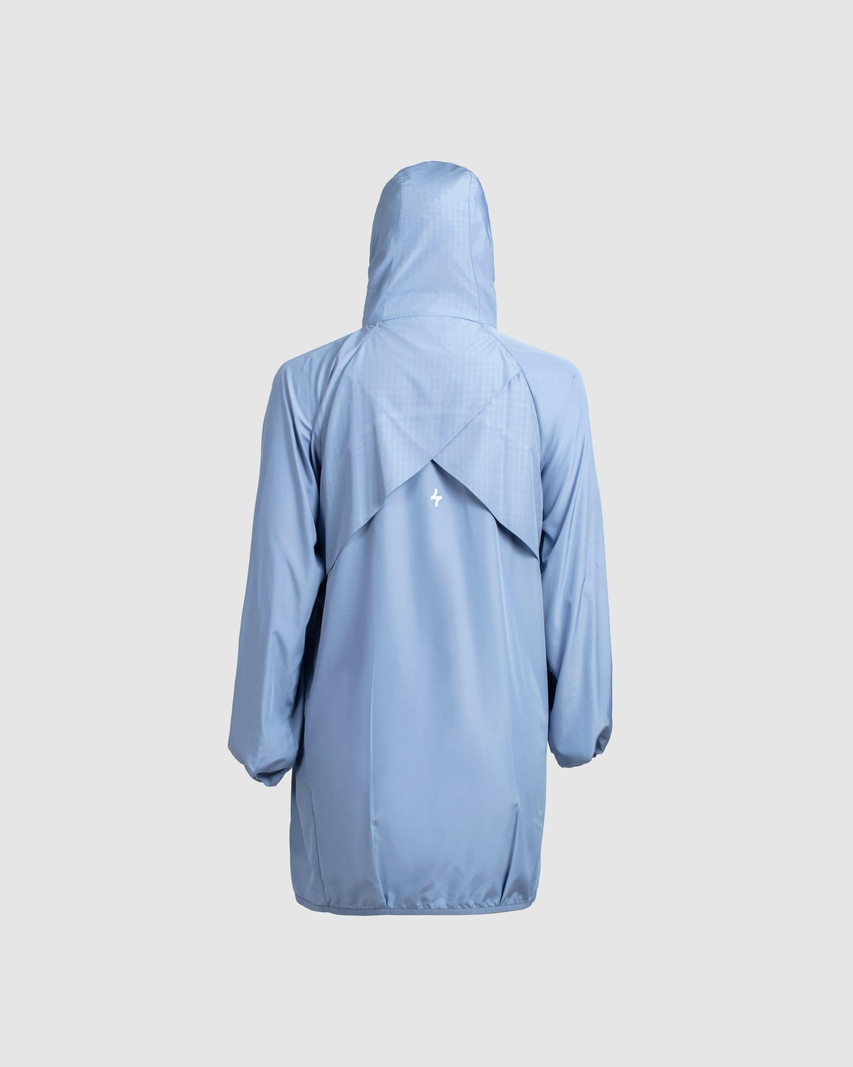 Back view of a lightweight Infinity Blue COOLDOWN coat by Qynda with a hood, displayed against a neutral background.