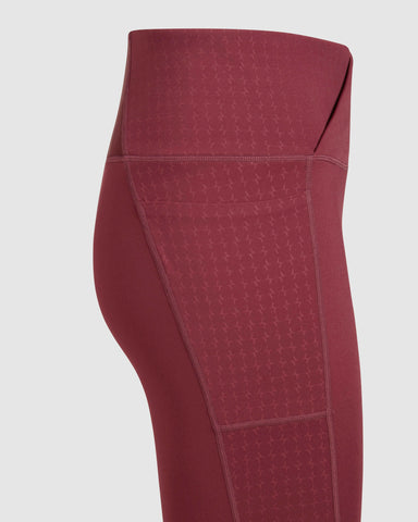 A close-up of a Maroon, LADINA LEGGINGS by Qynda.