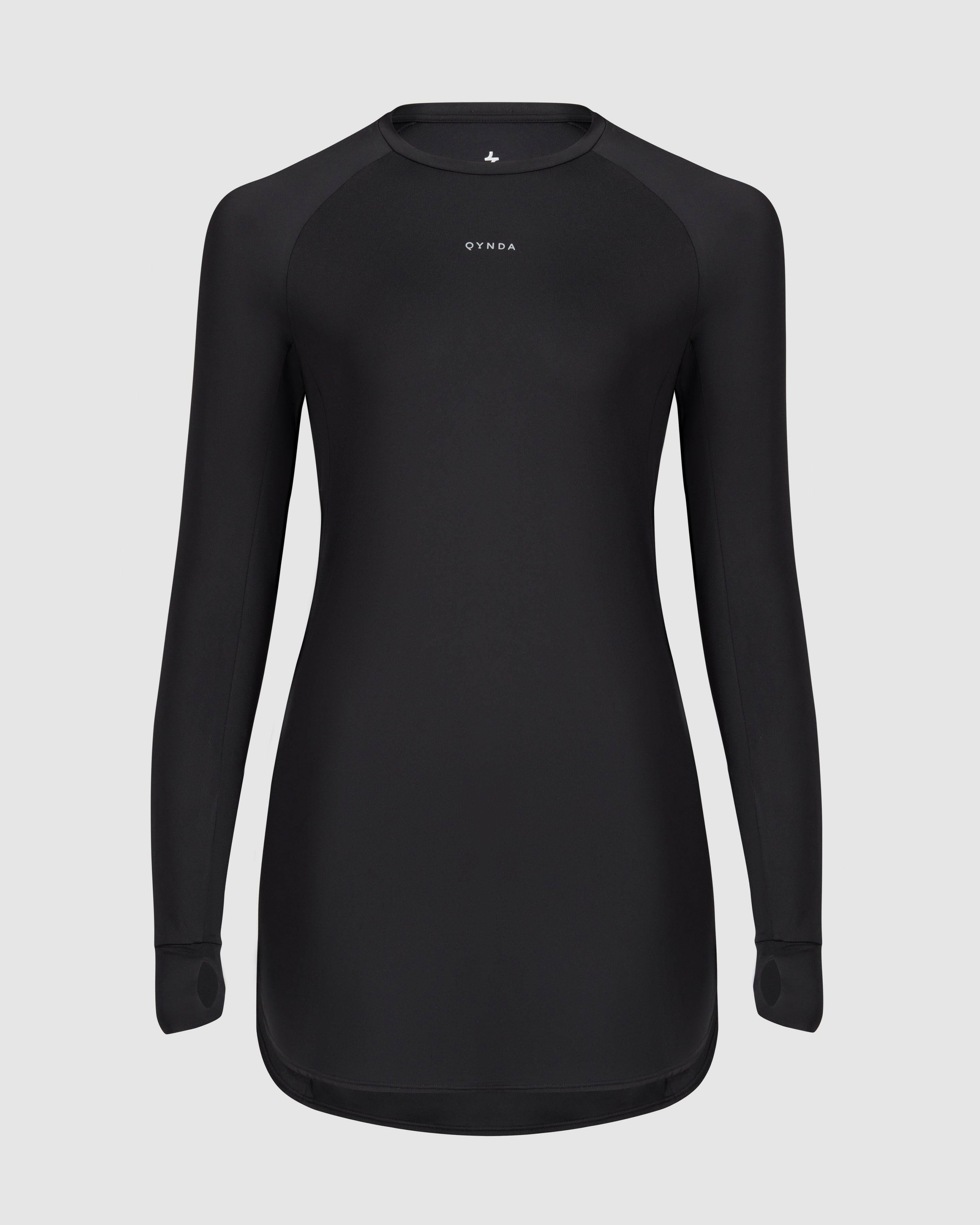 A, modest Black MOD LONG SLEEVE T-SHIRT by Qynda with a fitted design, prominently displaying a small Qynda logo on the chest. 
