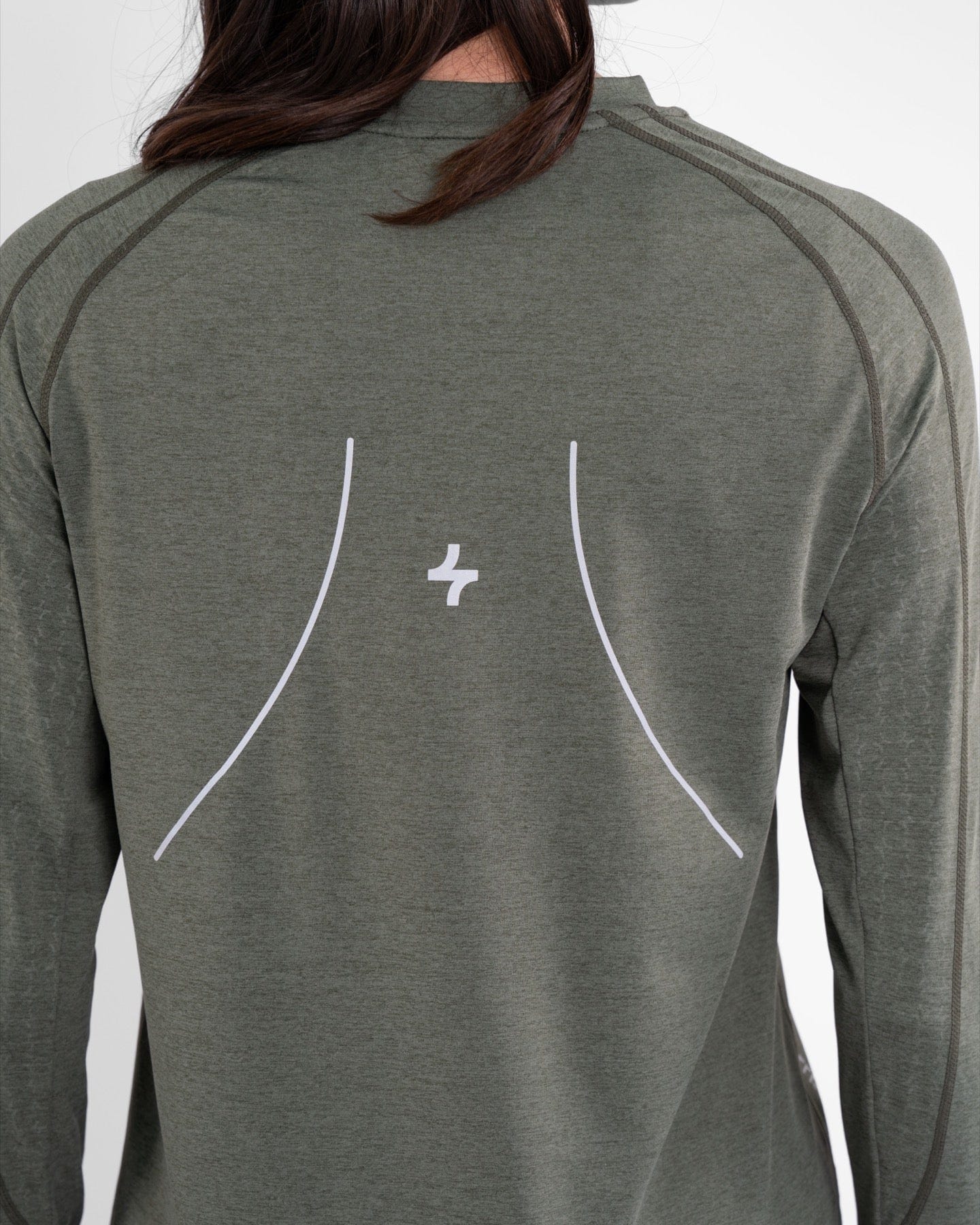 Close-up of the back of a woman's Olive modest LONG SLEEVE T-SHIRT with a qynda logo embroidered near the neckline.