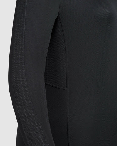 Close-up view of Black ACT LONG SLEEVE T-SHIRT with detailed stitching and a qynda logo.