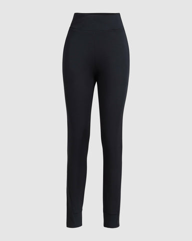 A pair of Black Modest JOG JOGGER by Qynda against a white background.